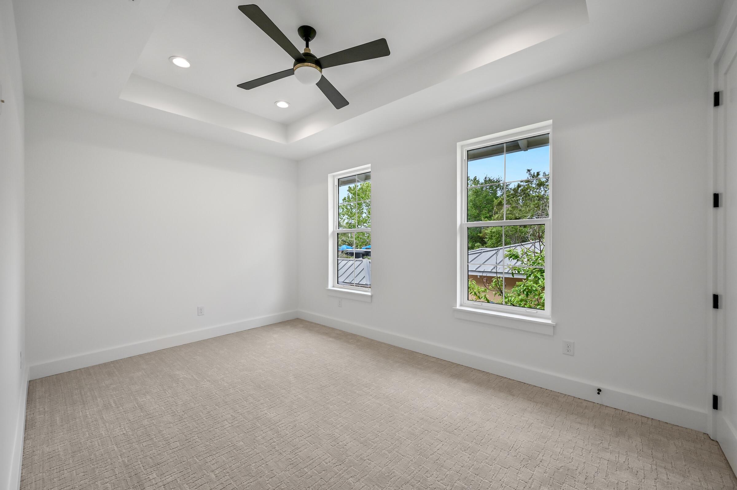 80 Rue Martine Miramar Beach, FL 32550 - Photo 43 of 54 an empty room with windows and ceiling fan