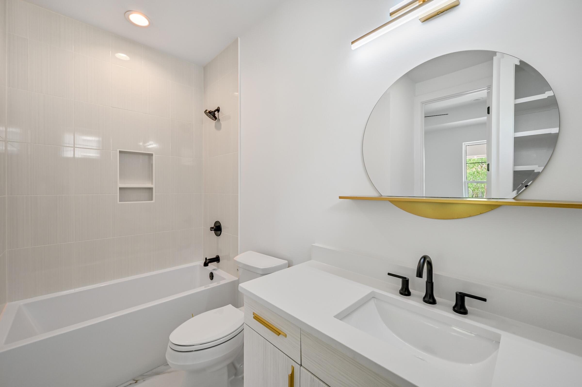 80 Rue Martine Miramar Beach, FL 32550 - Photo 48 of 54 a bathroom with a sink a toilet and a mirror