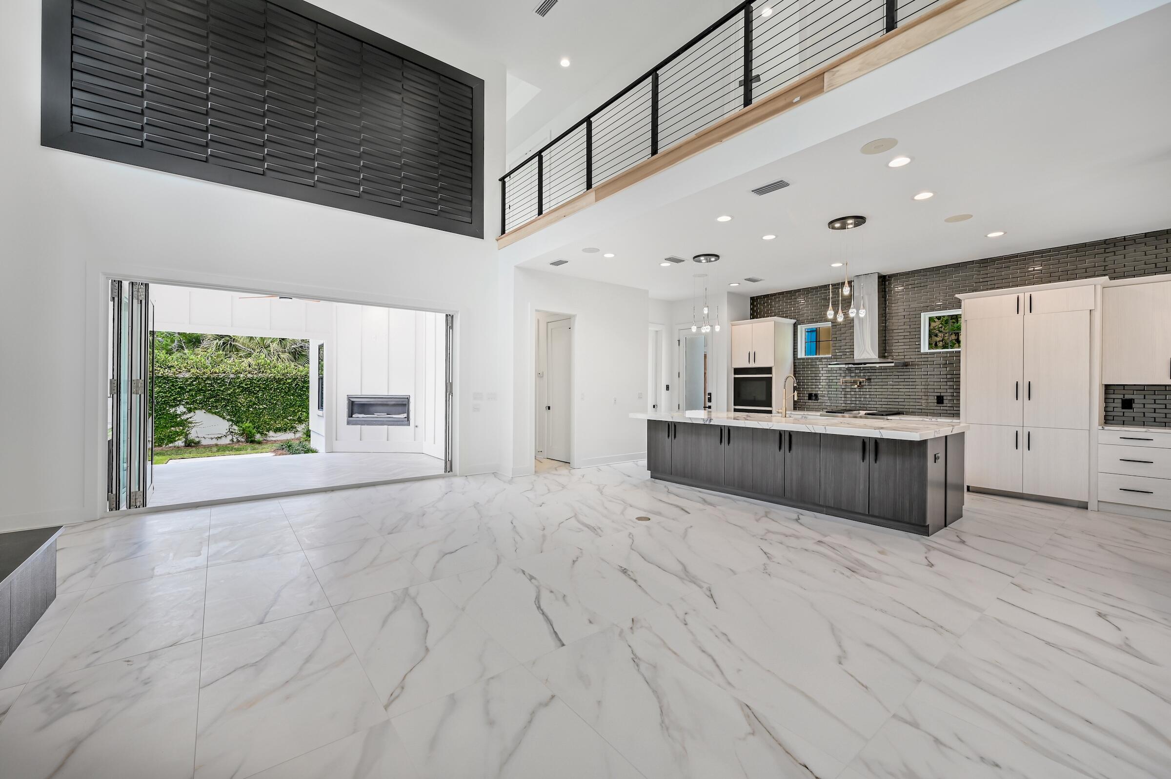 80 Rue Martine Miramar Beach, FL 32550 - Photo 5 of 54 a large white kitchen with a large window
