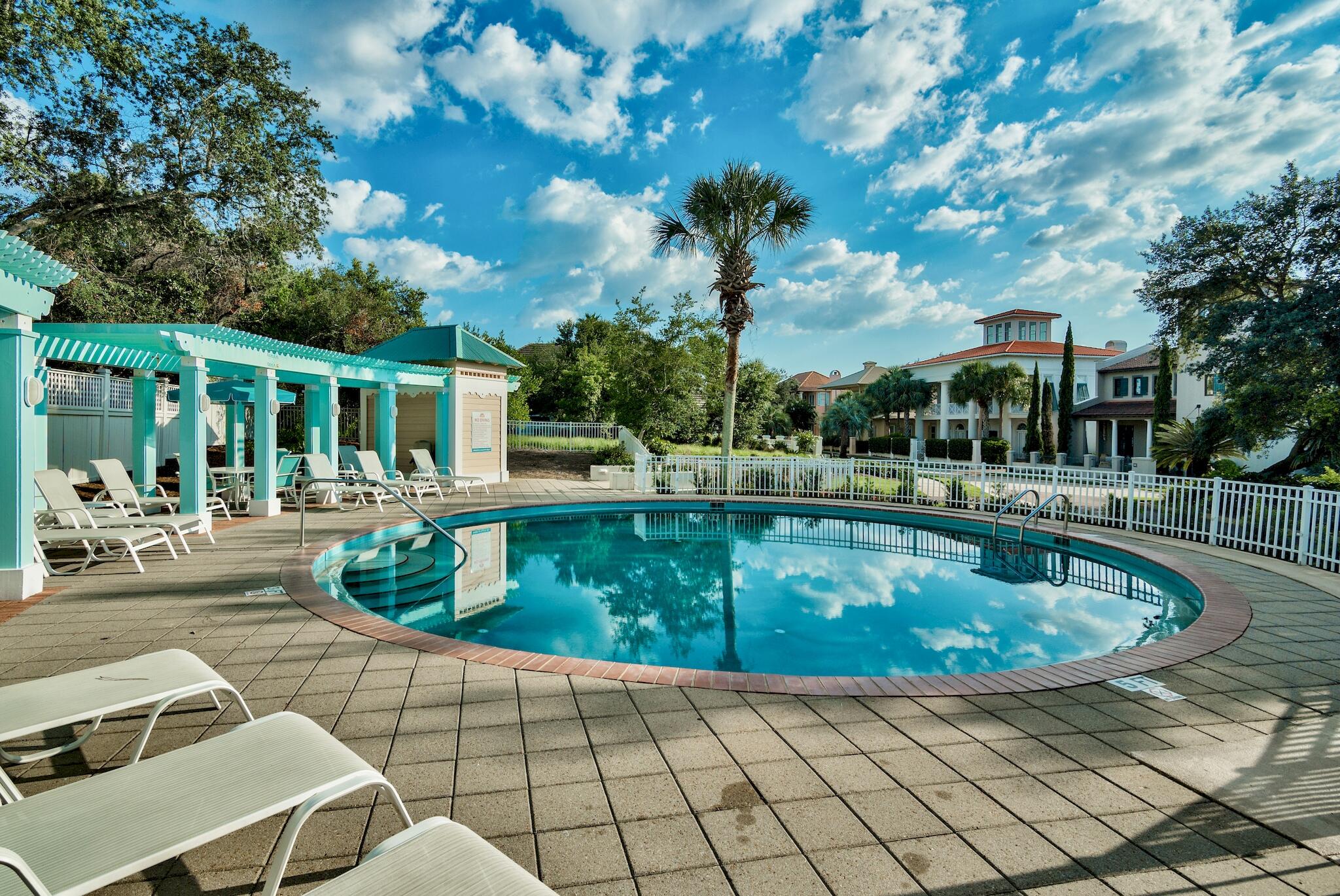 80 Rue Martine Miramar Beach, FL 32550 - Photo 54 of 54 a view of a swimming pool with lounge chair