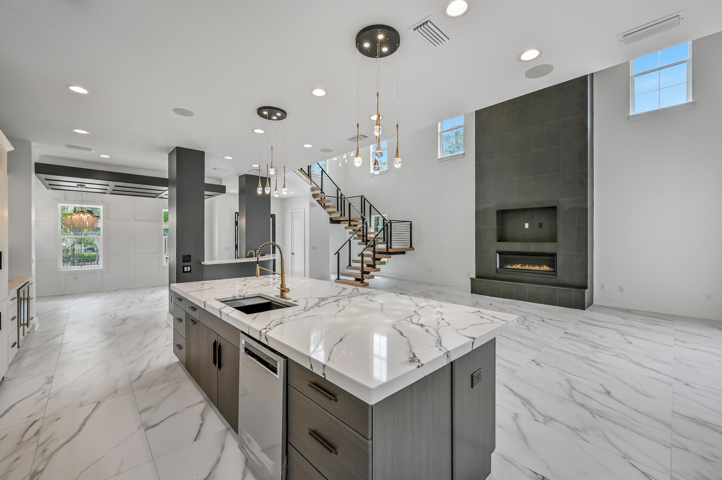 80 Rue Martine Miramar Beach, FL 32550 - Photo 10 of 54 a kitchen with stainless steel appliances granite countertop a sink and a stove