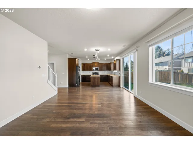 a view of kitchen with furniture and wooden floor