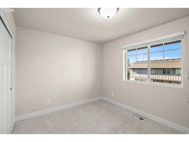 view of an empty room with a window