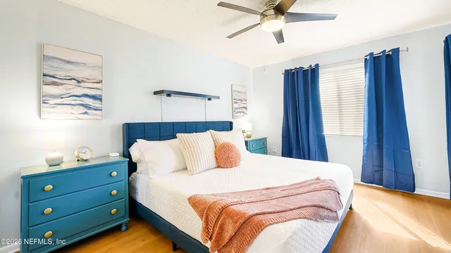 a bedroom with a bed and window