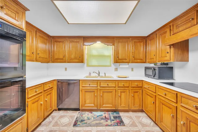 a kitchen with stainless steel appliances a refrigerator and a stove