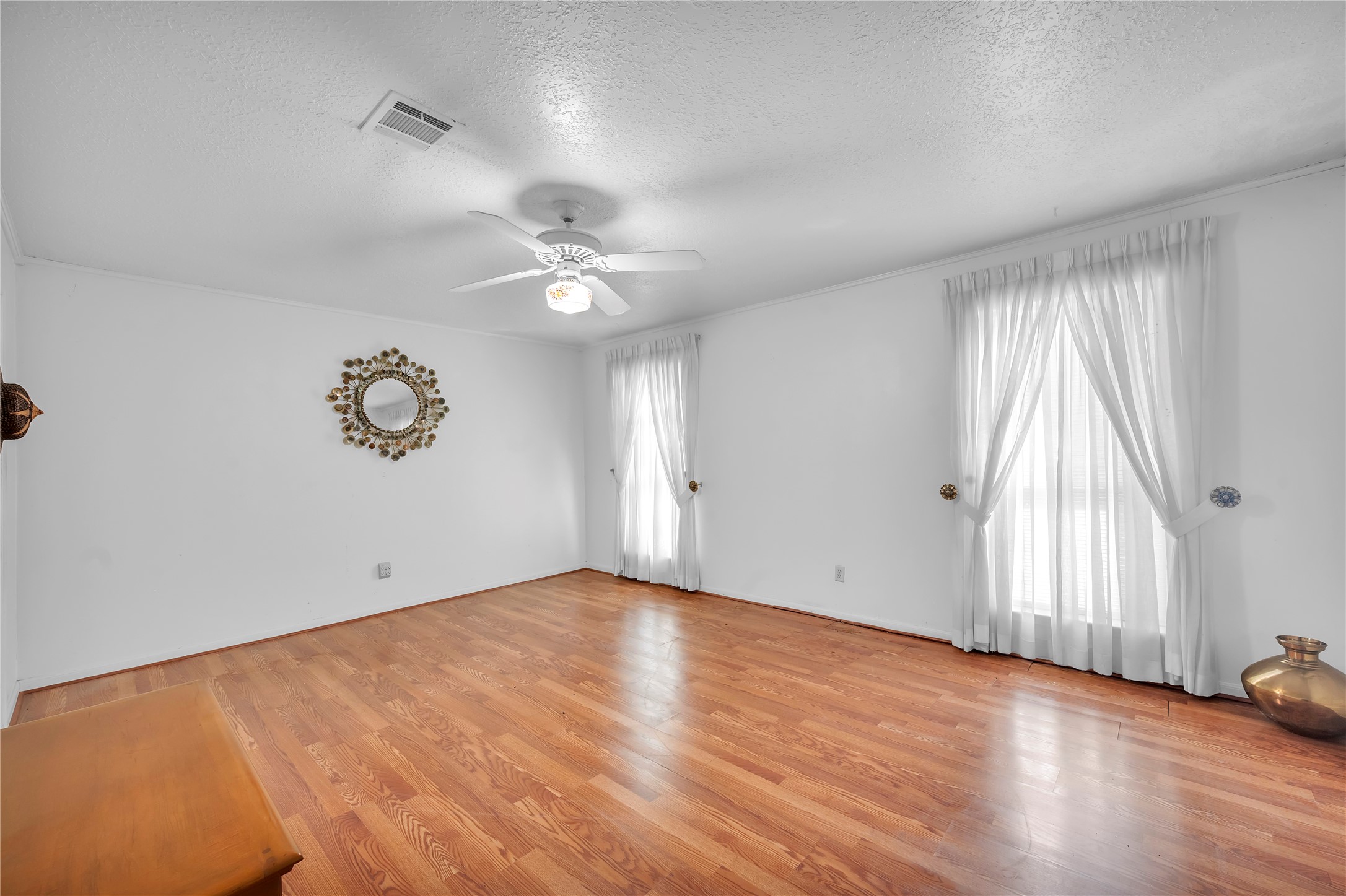 17903 Fireside Drive Spring, TX 77379 - Photo 18 of 33 an empty room with wooden floor and windows