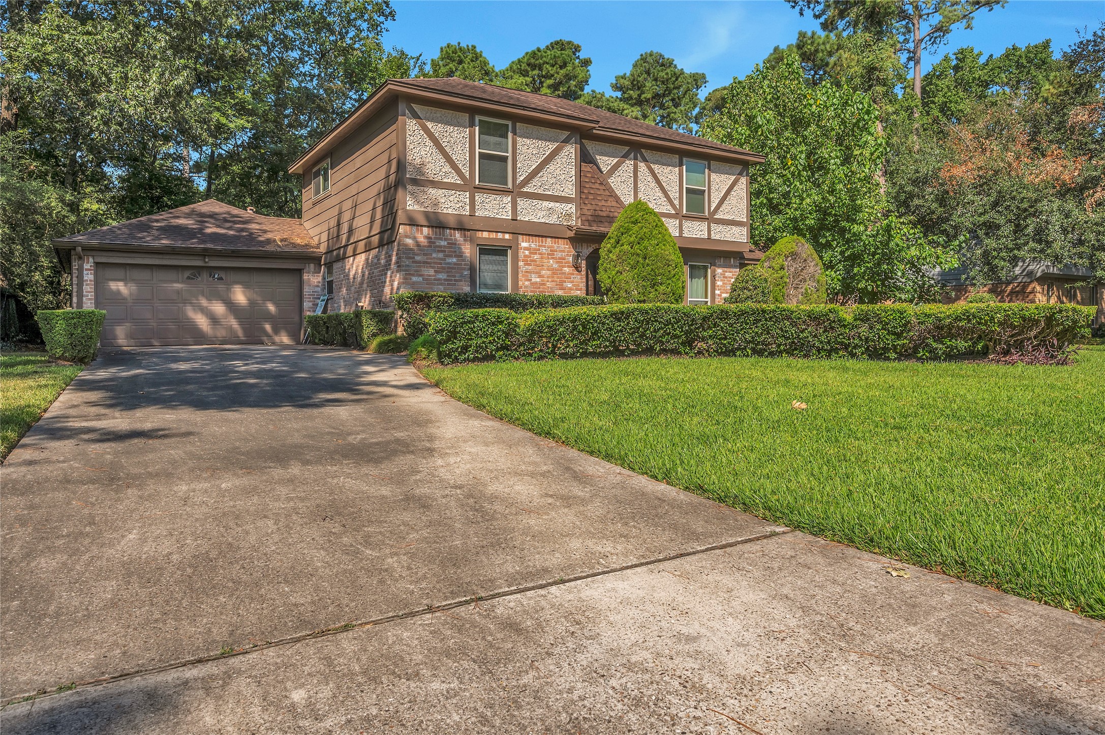 17903 Fireside Drive Spring, TX 77379 - Photo 2 of 33 a front view of a house with a yard and garage