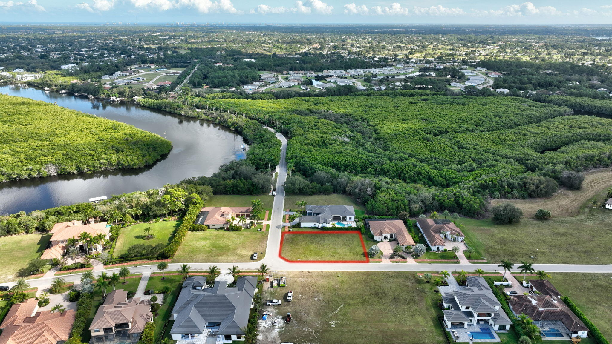 183 Southeast Via Terra Bella Port St. Lucie, FL 34952 - Photo 19 of 26 a view of a lake with a city