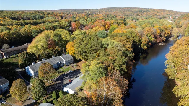 an aerial view of house with yard