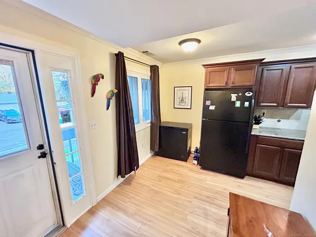 a kitchen with stainless steel appliances granite countertop a refrigerator stove and a refrigerator
