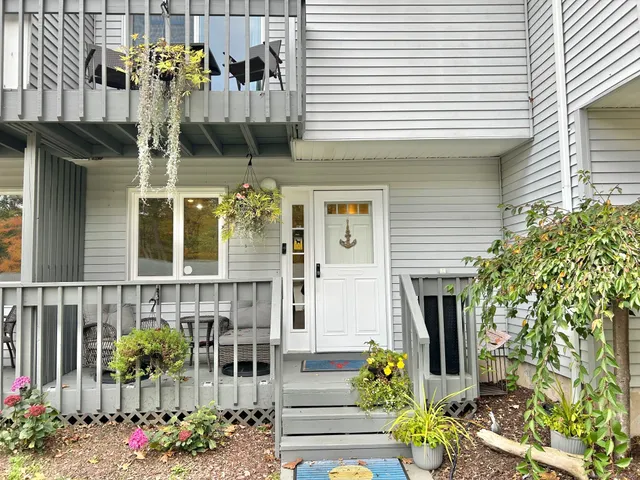 a front view of a house with outdoor seating and plants