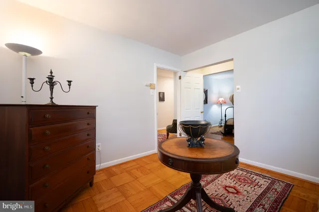 a living room with furniture and a mirror