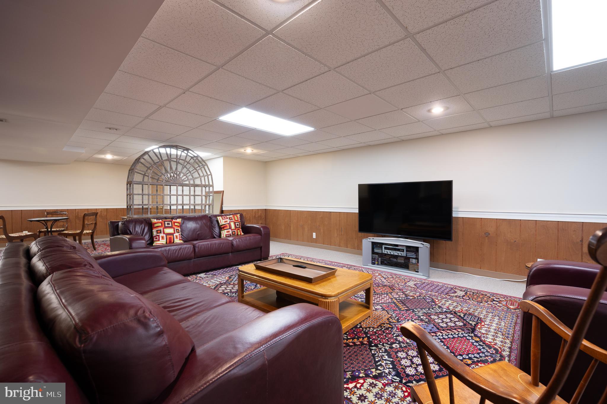 1822 Foulk Road Wilmington, DE 19810 - Photo 19 of 32 a living room with furniture and a flat screen tv