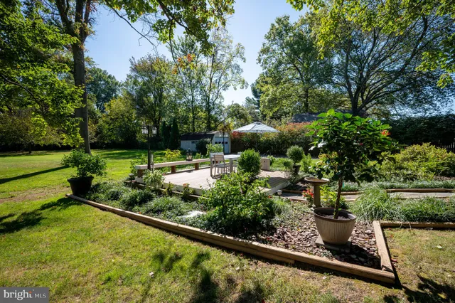 a view of a backyard with sitting area