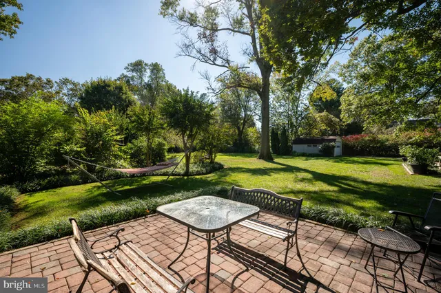 a backyard view with a seating space
