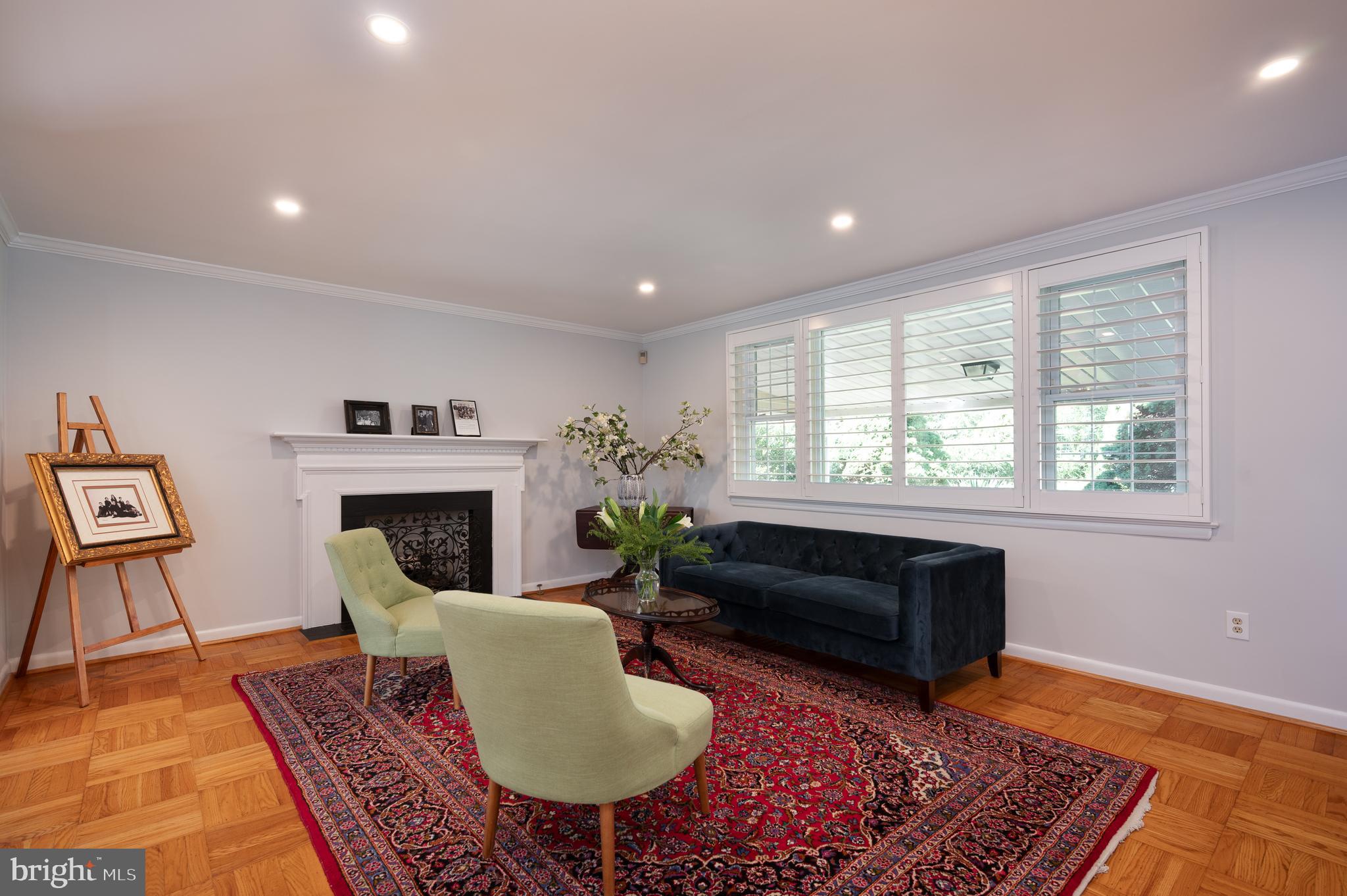 1822 Foulk Road Wilmington, DE 19810 - Photo 4 of 32 a living room with furniture a rug and a fireplace