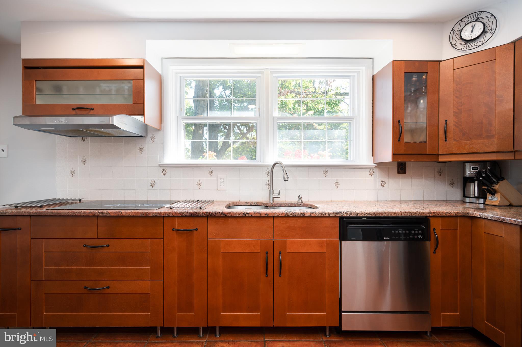 1822 Foulk Road Wilmington, DE 19810 - Photo 9 of 32 a kitchen with stainless steel appliances wooden cabinets and a sink