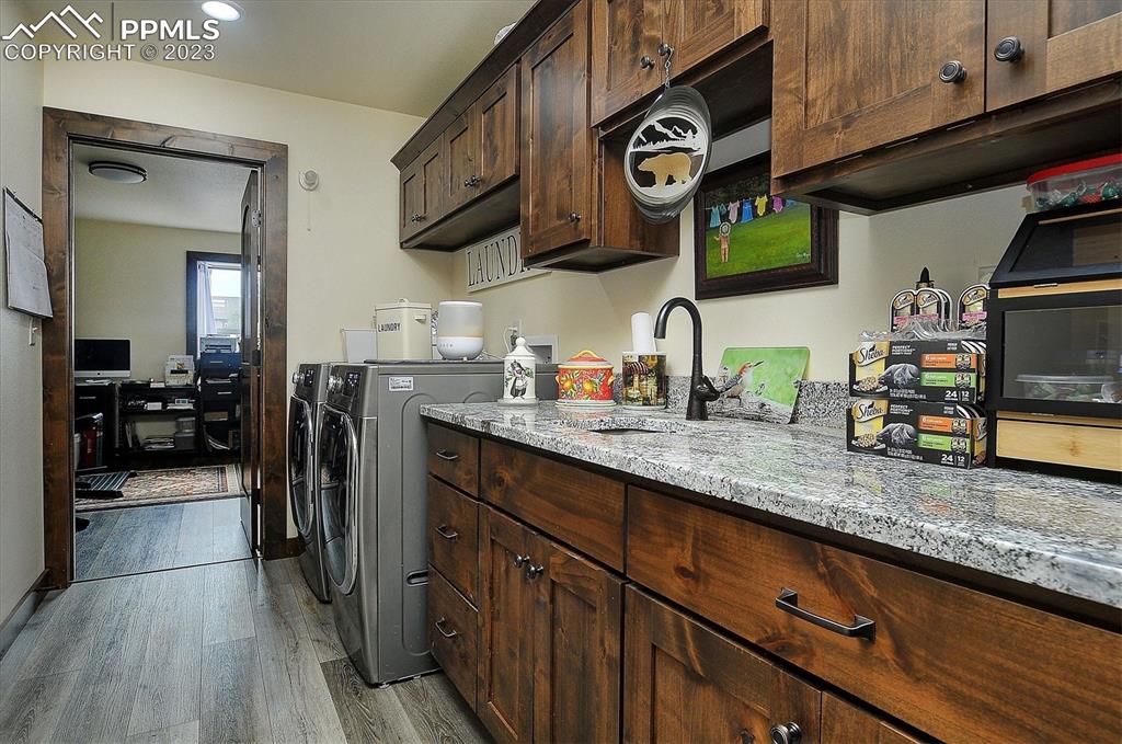 114 3rd Street Silver Cliff, CO 81252 - Photo 12 of 23 a kitchen with stainless steel appliances granite countertop a sink and cabinets