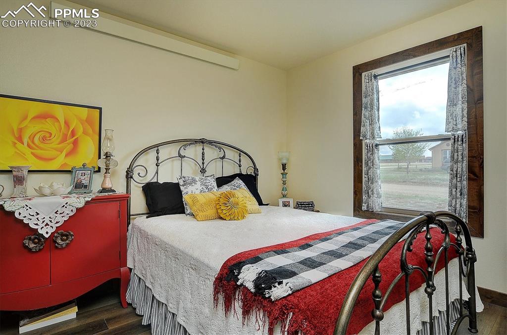 114 3rd Street Silver Cliff, CO 81252 - Photo 15 of 23 a bedroom with a bed and window