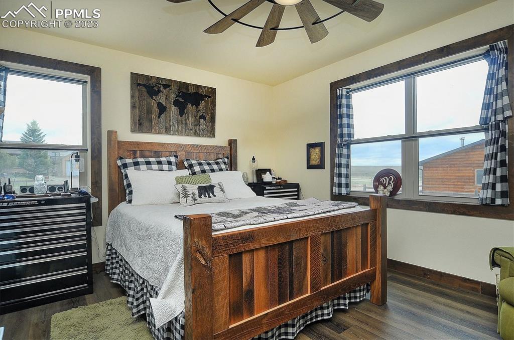 114 3rd Street Silver Cliff, CO 81252 - Photo 16 of 23 a bedroom with a bed and a window