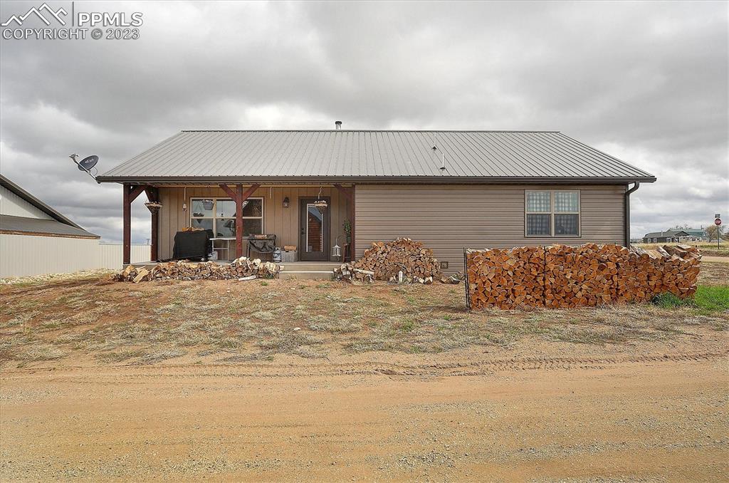 114 3rd Street Silver Cliff, CO 81252 - Photo 21 of 23 a view of a house with a patio