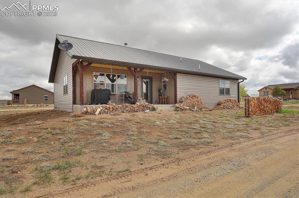 114 3rd Street Silver Cliff, CO 81252 - Photo 22 of 23 a view of a house with backyard