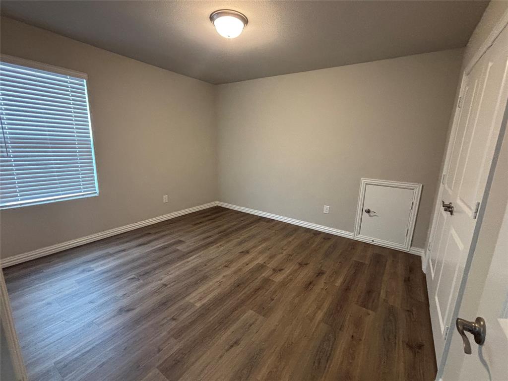 1510 Crystal Vly Way Melissa, TX 75454 - Photo 18 of 24 an empty room with wooden floor and window