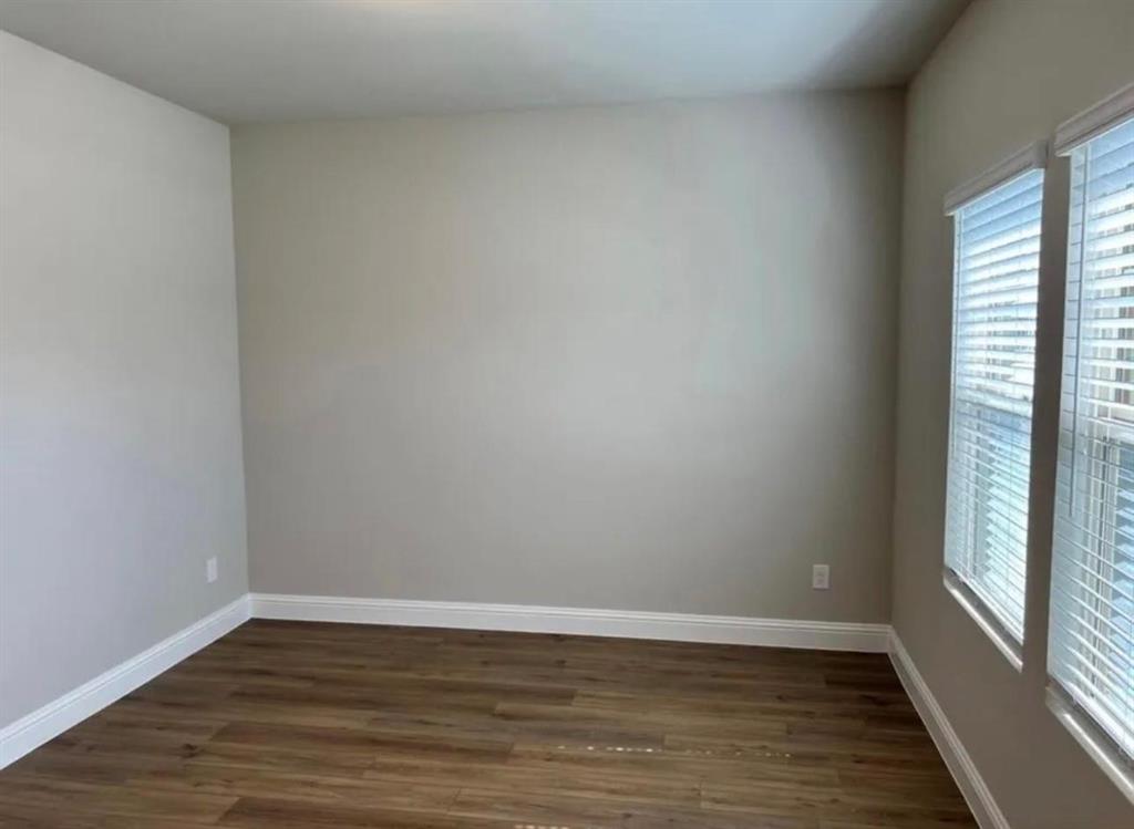 1510 Crystal Vly Way Melissa, TX 75454 - Photo 3 of 24 a view of an empty room with wooden floor and a window