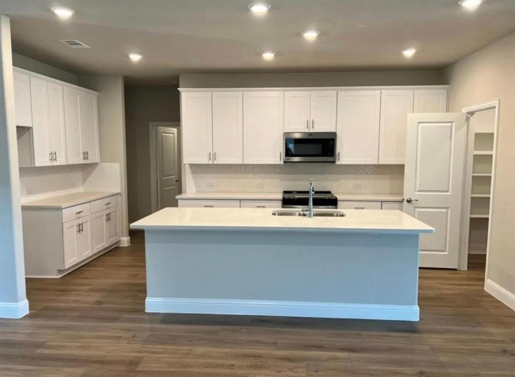 1510 Crystal Vly Way Melissa, TX 75454 - Photo 6 of 24 a view of kitchen with stainless steel appliances granite countertop a stove a sink and a refrigerator