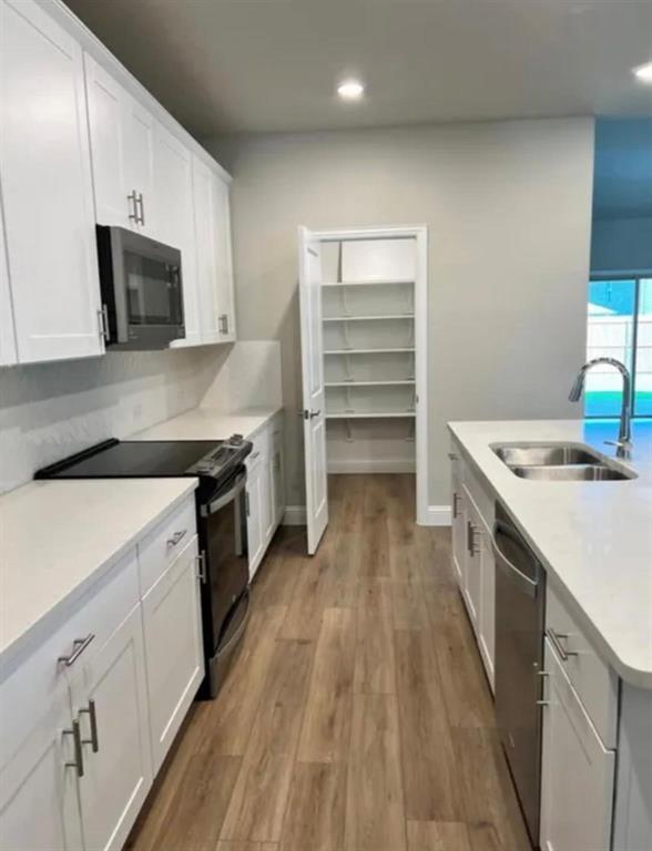 1510 Crystal Vly Way Melissa, TX 75454 - Photo 7 of 24 a kitchen with a sink stove top oven and cabinets