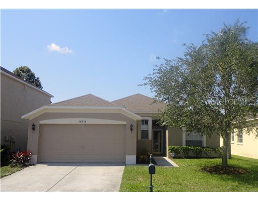 10535 Peppergrass Court Trinity, FL 34655 - Photo 1 of 1 a front view of a house with a yard and garage