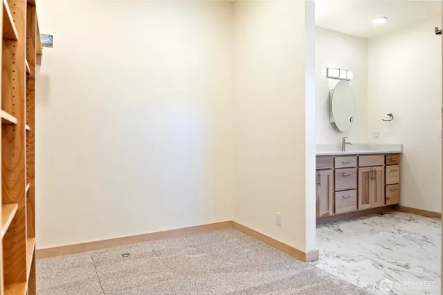 a view of a hallway to rooms