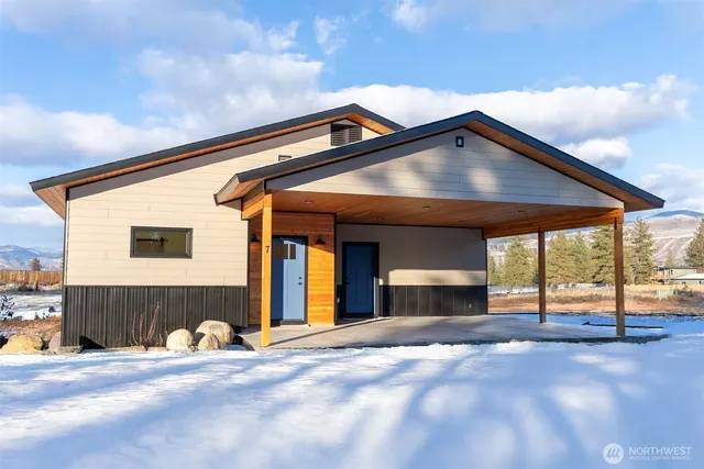 a front view of a house with a garage