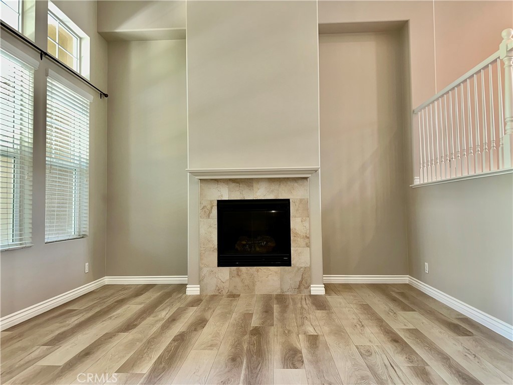 21 Durlston Way Ladera Ranch, CA 92694 - Photo 5 of 47 a view of an empty room with a fireplace and a window