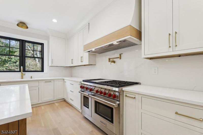 25 Beverly Road Madison, NJ 07940 - Photo 13 of 47 a kitchen with granite countertop a stove and a sink