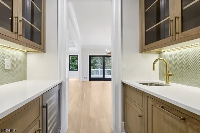 a kitchen with stainless steel appliances a sink and cabinets