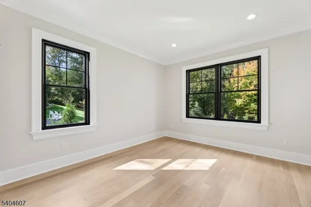 an empty room with large windows