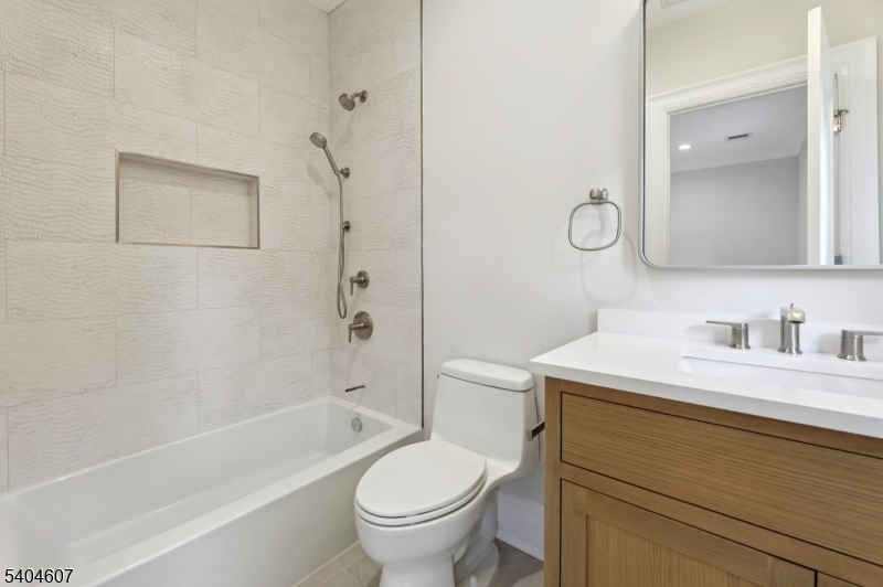 25 Beverly Road Madison, NJ 07940 - Photo 27 of 47 a bathroom with a sink a toilet and a bathtub