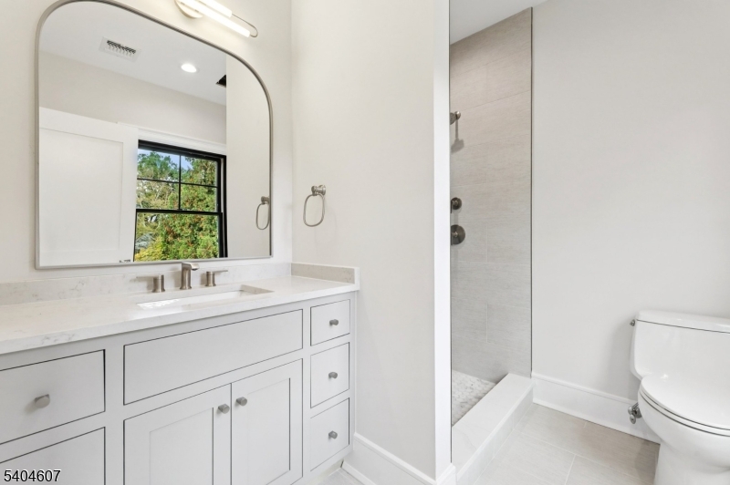 25 Beverly Road Madison, NJ 07940 - Photo 31 of 47 a bathroom with a sink a toilet and shower