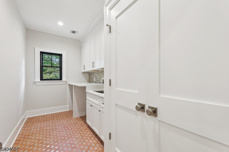 25 Beverly Road Madison, NJ 07940 - Photo 36 of 47 a bathroom with a sink a window and a shower