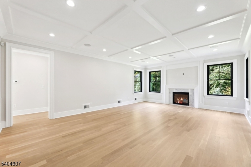 25 Beverly Road Madison, NJ 07940 - Photo 6 of 47 an empty room with windows and fireplace