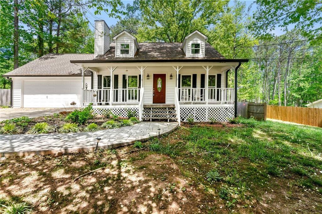 front view of a house with a yard