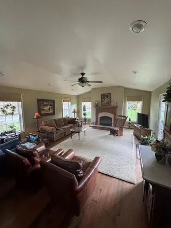 a living room with furniture and a fireplace