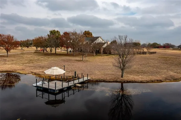 a view of a lake with outdoor seating