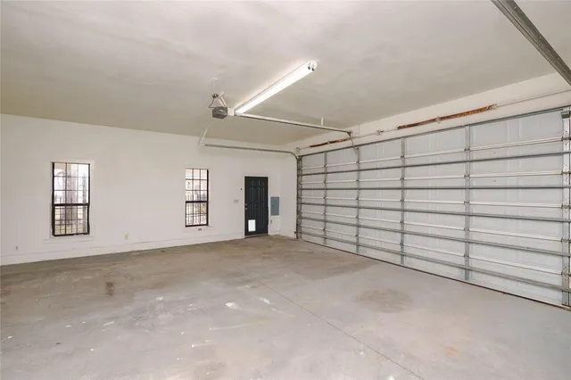 a view of an empty room with a large window