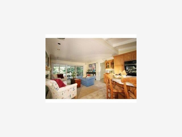 13841 Robleda Road Los Altos Hills, CA 94022 - Photo 2 of 7 a living room with furniture and a table