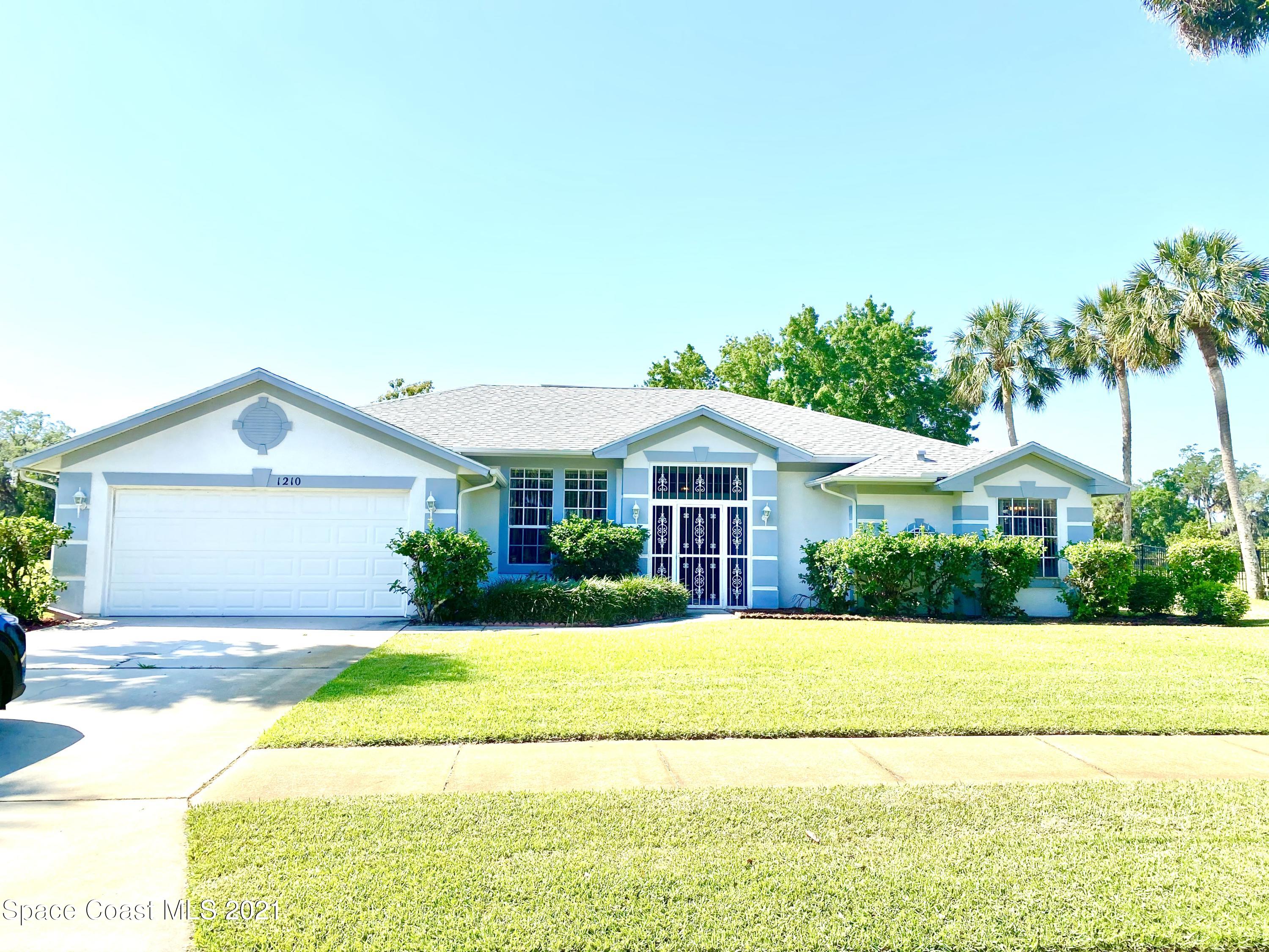 1210 Meadowbrook Road Northeast Palm Bay, FL 32905 - Photo 1 of 36 Front