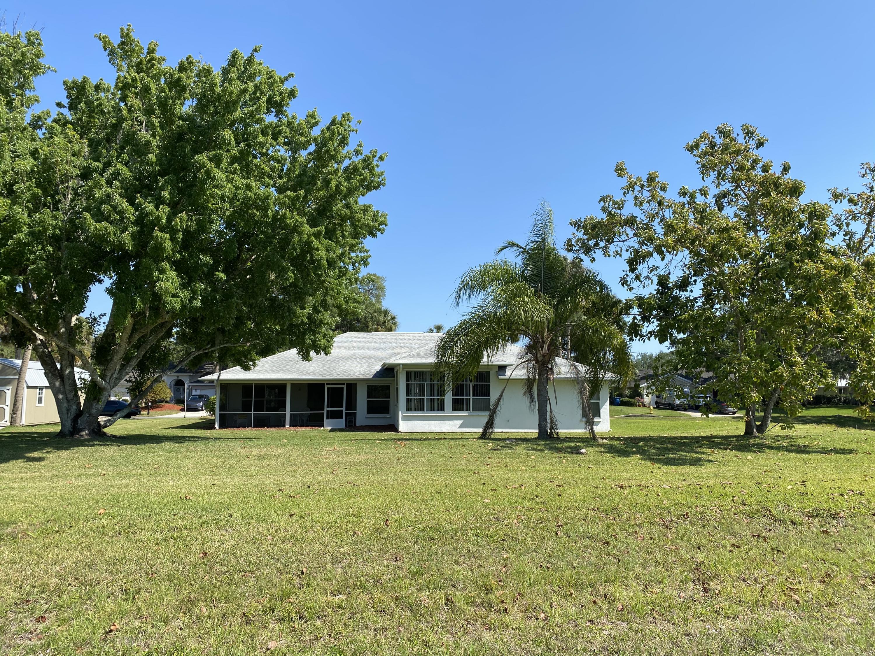 1210 Meadowbrook Road Northeast Palm Bay, FL 32905 - Photo 3 of 36 Back house