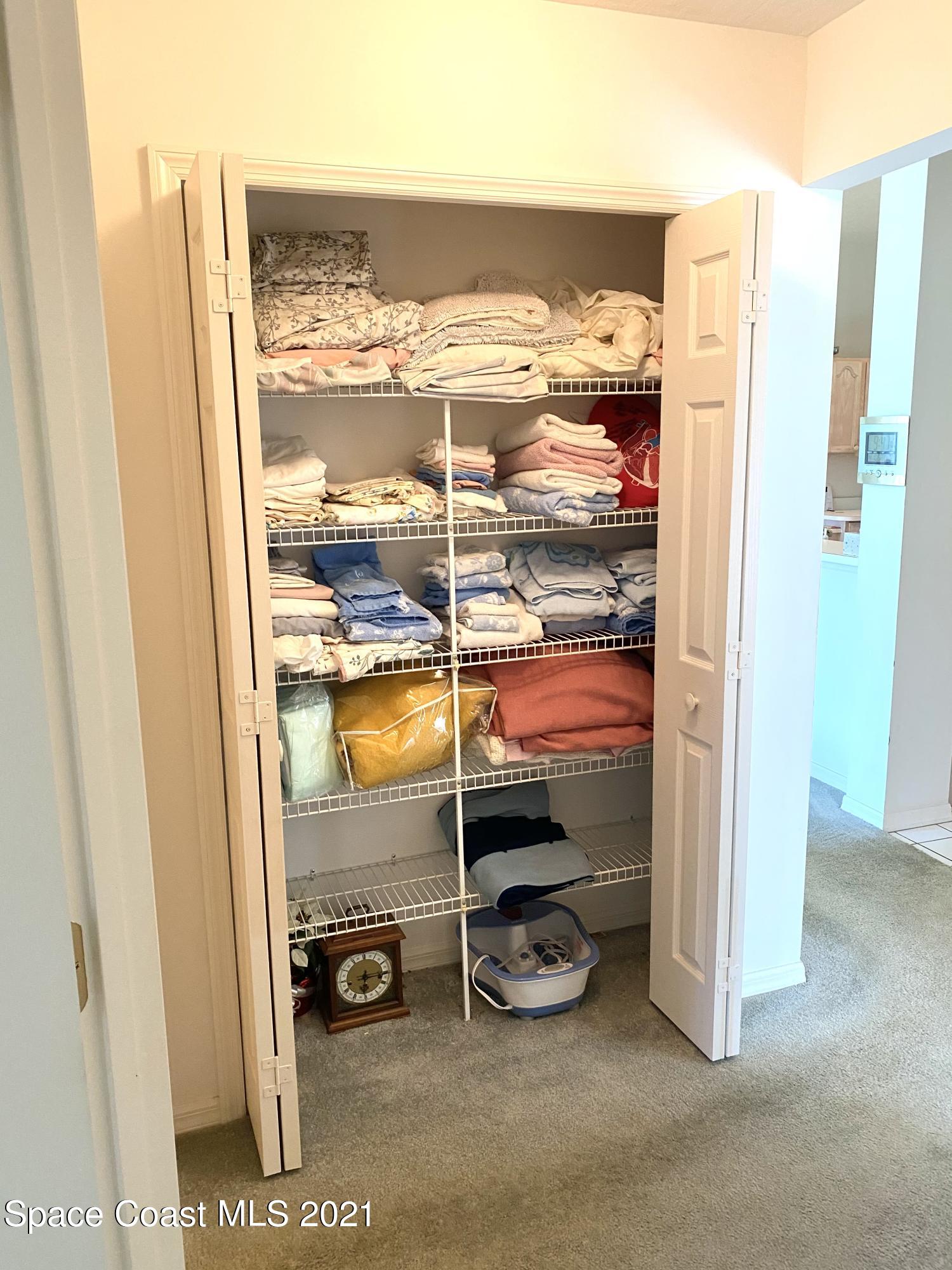 1210 Meadowbrook Road Northeast Palm Bay, FL 32905 - Photo 24 of 36 Linen closet