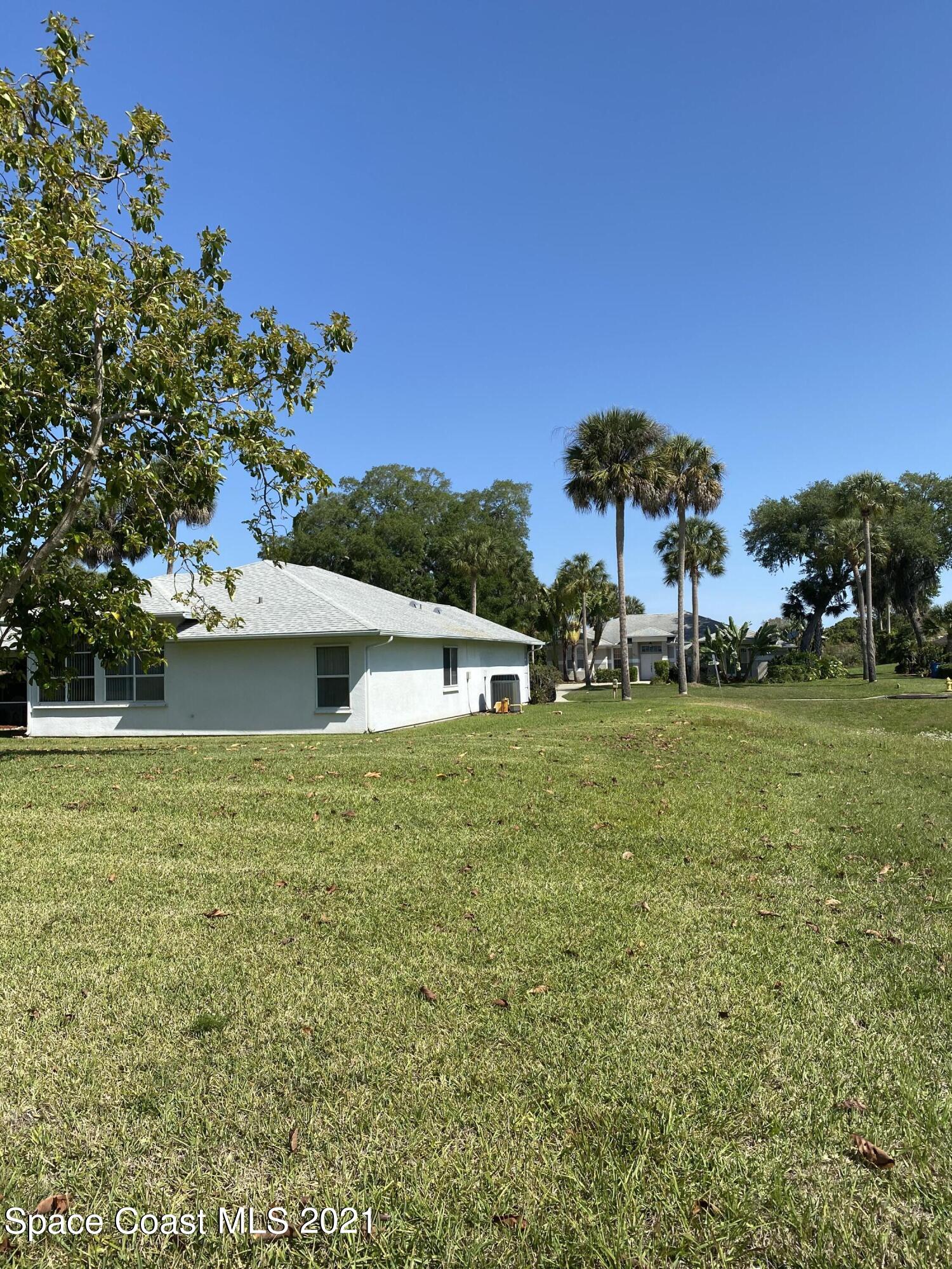 1210 Meadowbrook Road Northeast Palm Bay, FL 32905 - Photo 6 of 36 Side yard